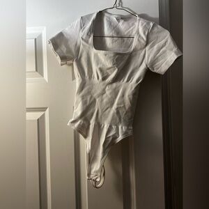 White bodysuit with with square neckline